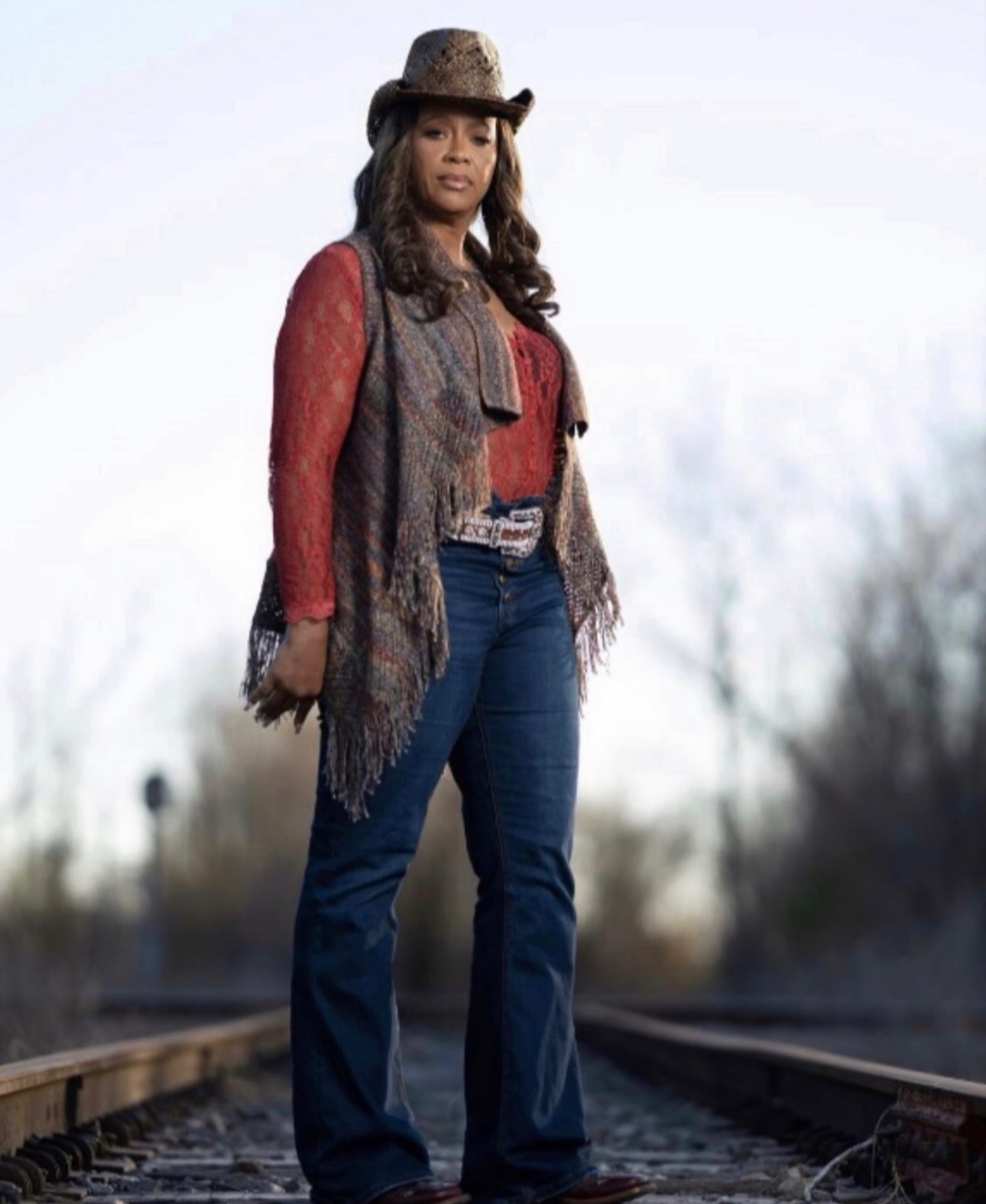 Tiffany Rachal on railroad tracks — western editorial